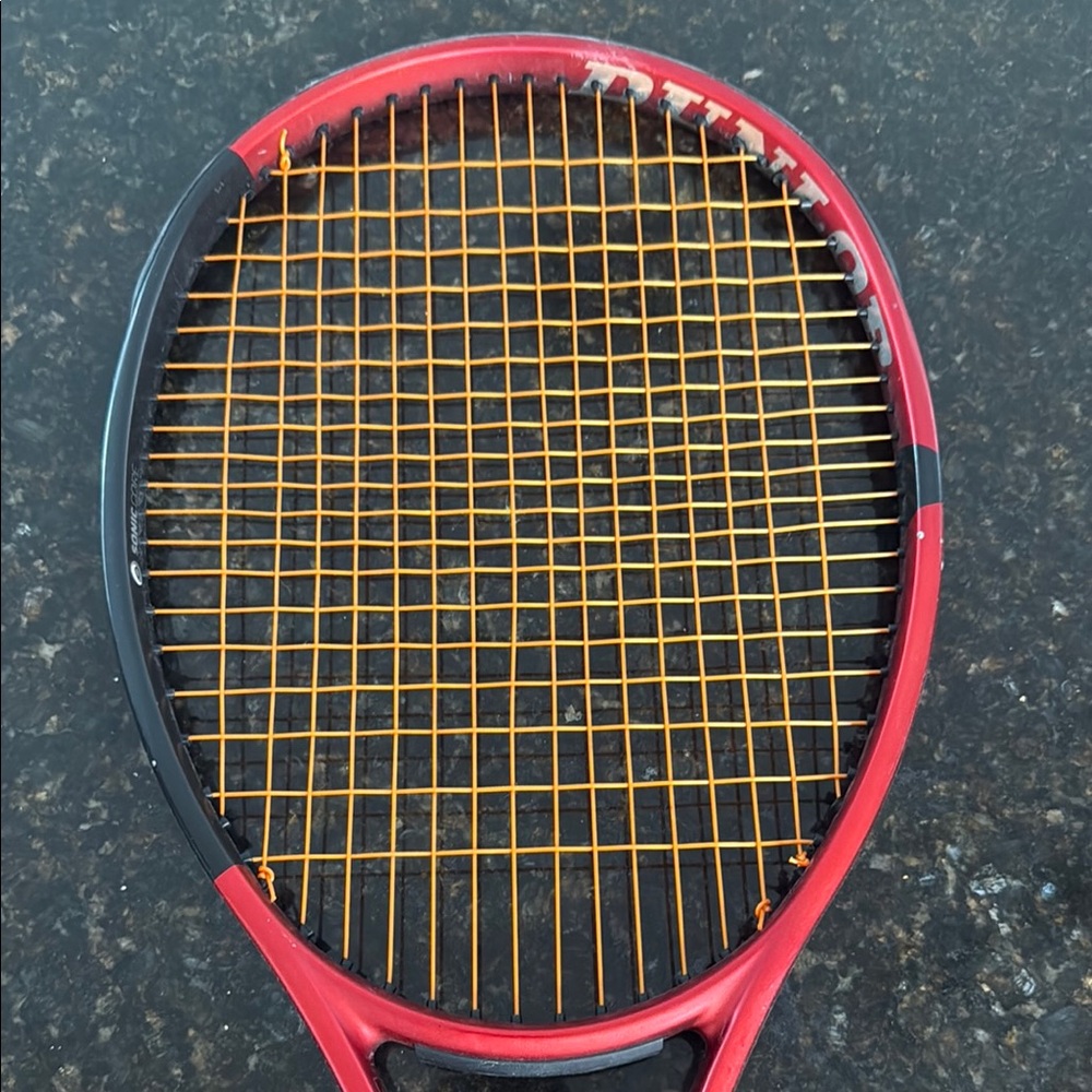 Red Tennis Racket with Orange Strings